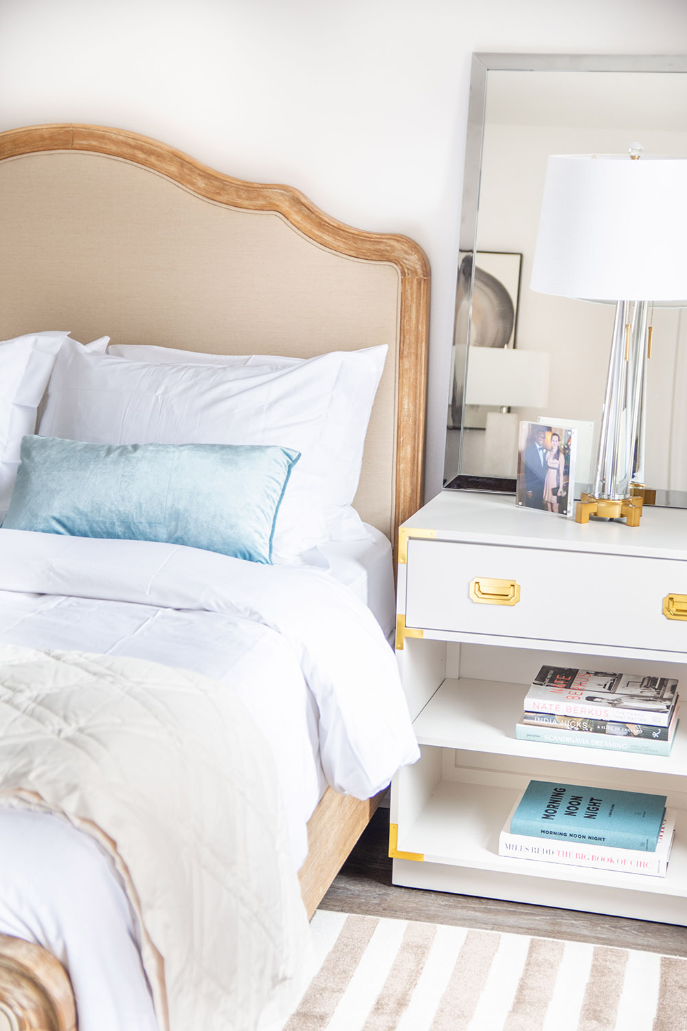A bedroom scene with a bed and nightstand. A bedroom scene with a bed and nightstand.