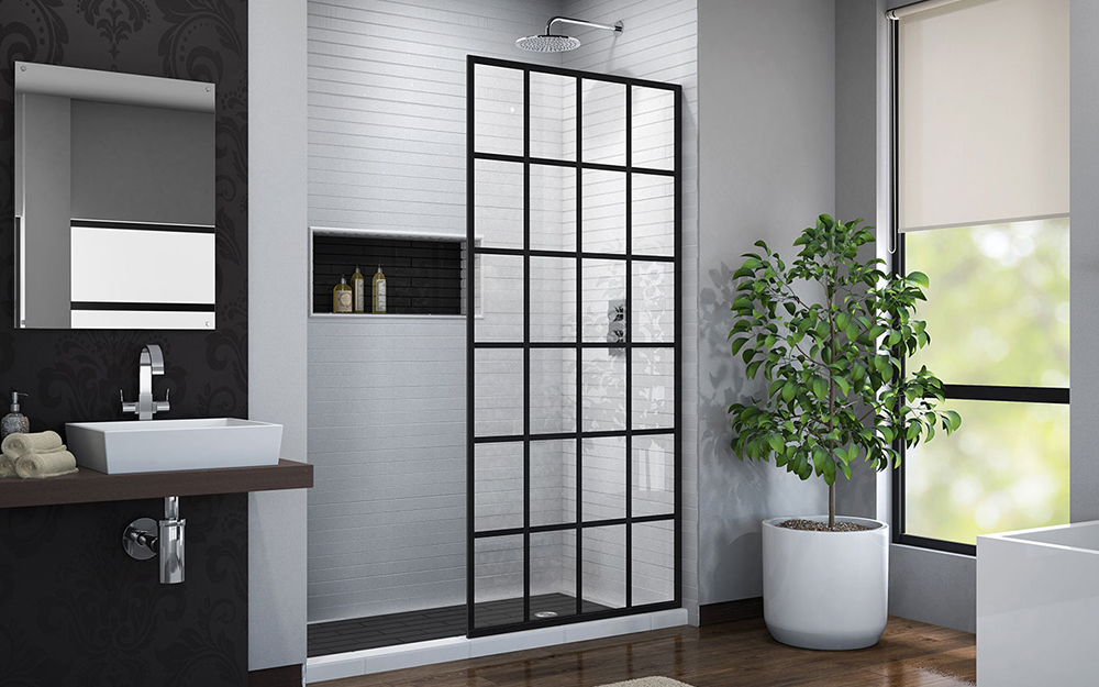 A barrier-free shower with a fixed shower door panel.