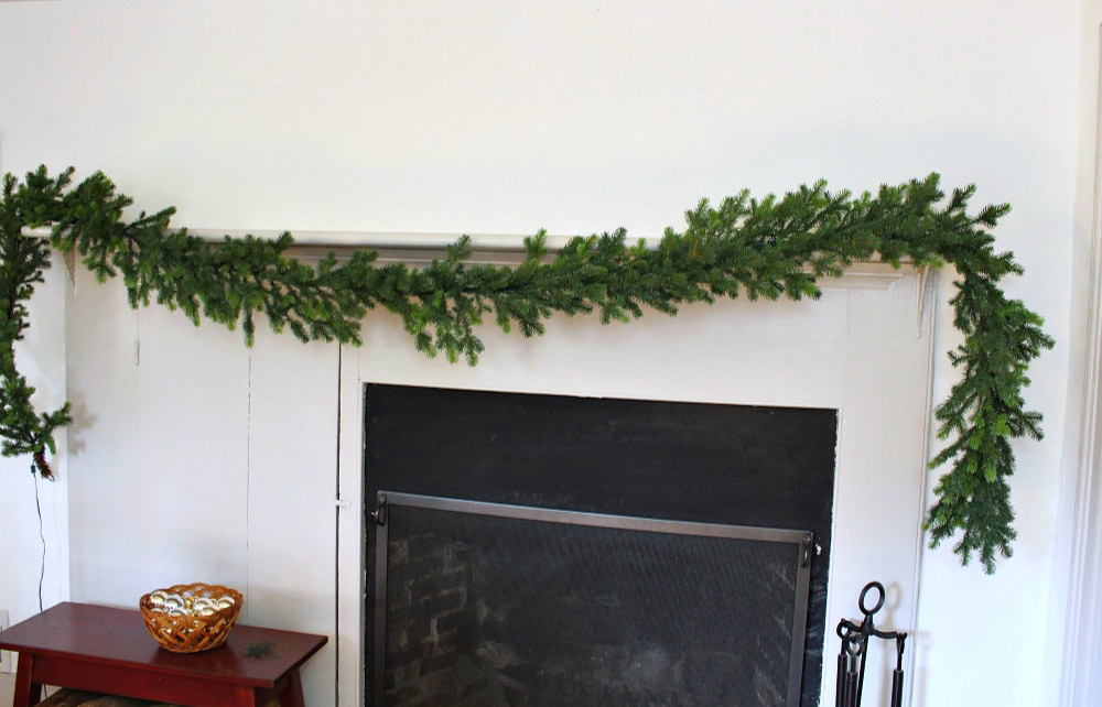 Holiday garland hung on a mantel. 