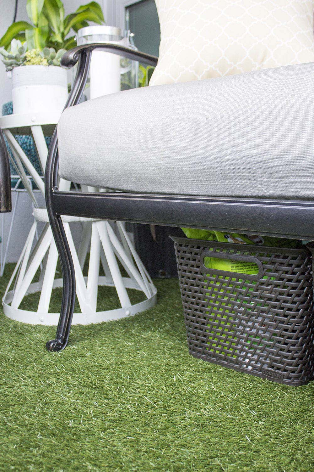 A basket underneath outdoor furniture. A basket underneath outdoor furniture.