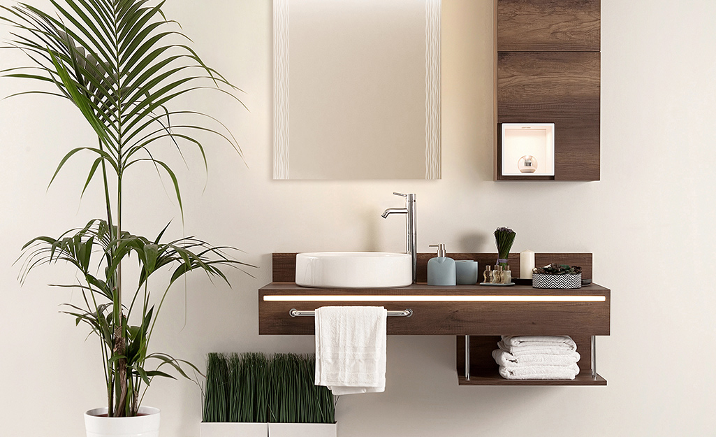 Floating vanity with built-in storage hanging on a wall.