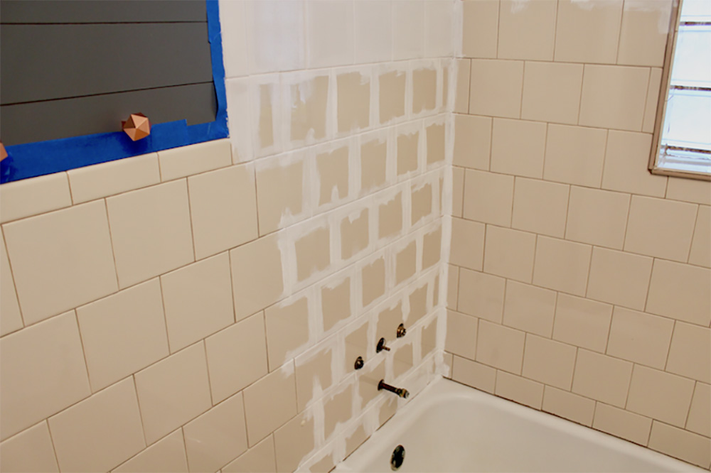 A partially painted shower wall.