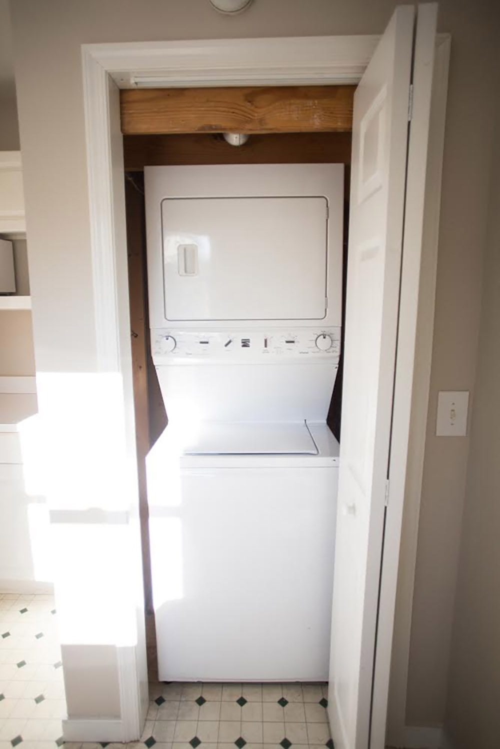 A closet with a white washer and dryer.