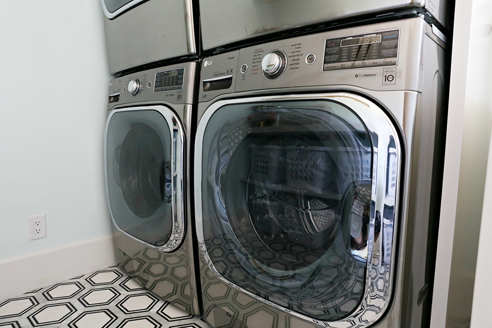 A smart dryer installed next to a matching smart washer.