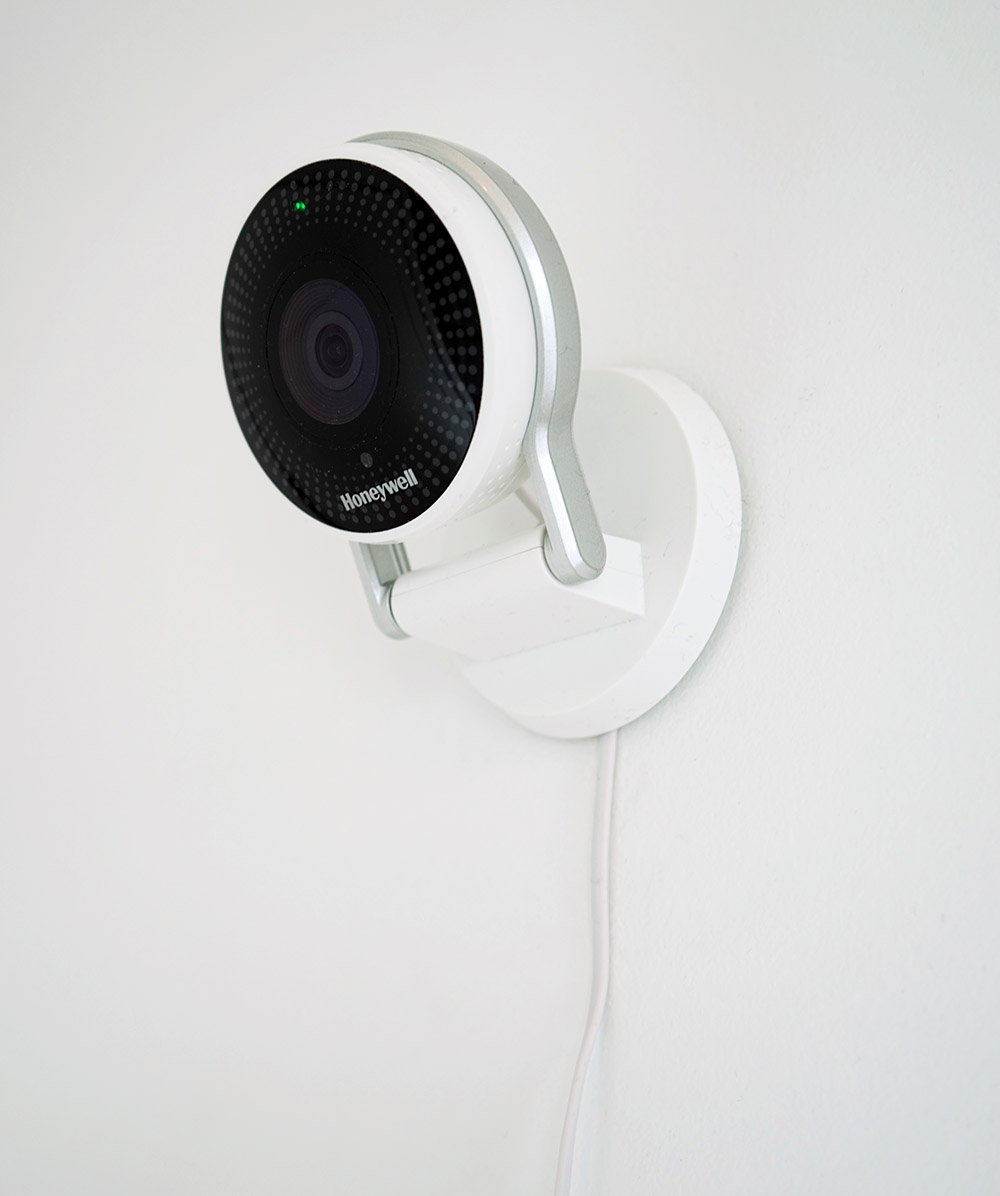 A smart security camera installed on a wall