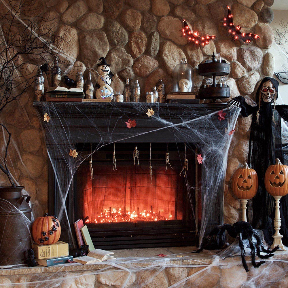 A black mantel decorated for Halloween.