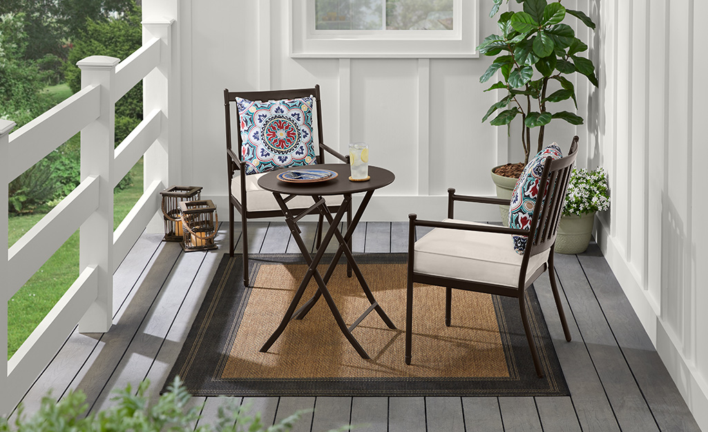 An outdoor patio set with natural rug. An outdoor patio set with natural rug.