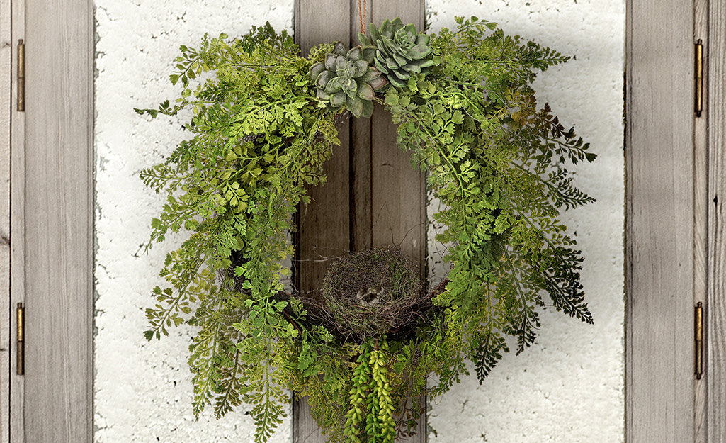 A plant wreath with succulent accents. A plant wreath with succulent accents.