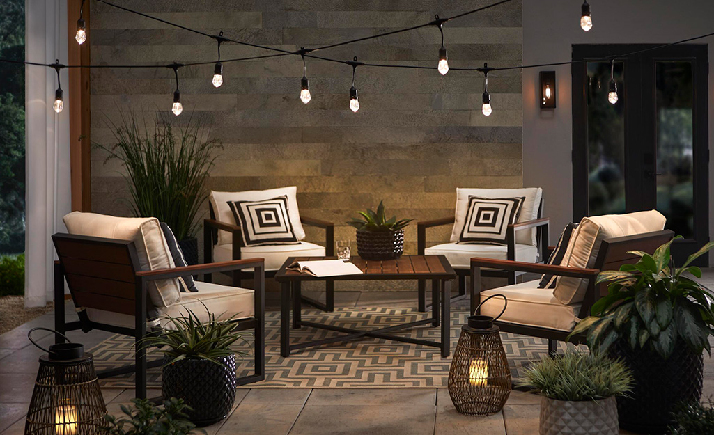 A neutral outdoor patio set with string lights. A neutral outdoor patio set with string lights.