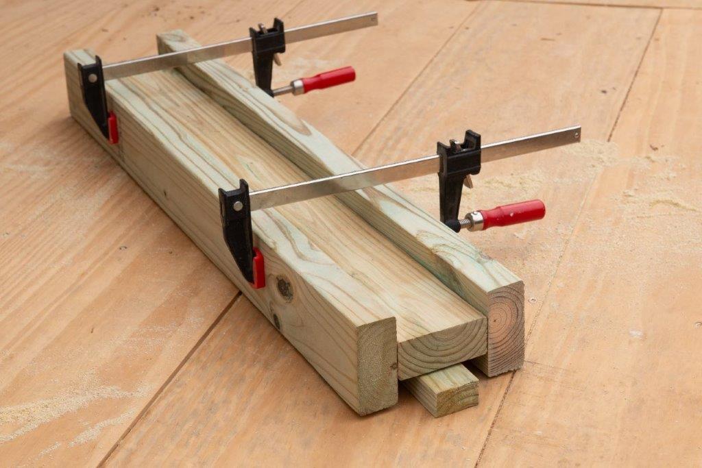 I-beams are positioned and them clamped together before fastening with screws. I-beams are positioned and them clamped together before fastening with screws.