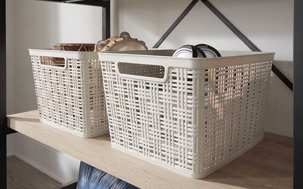 Two matching storage crates stacked on a shelf.