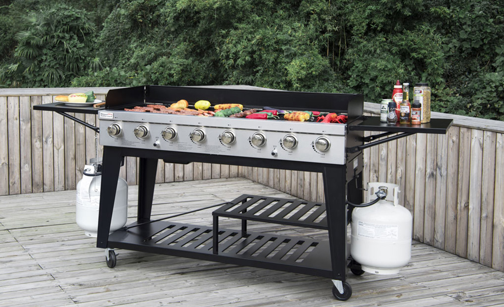 A grill on a deck.