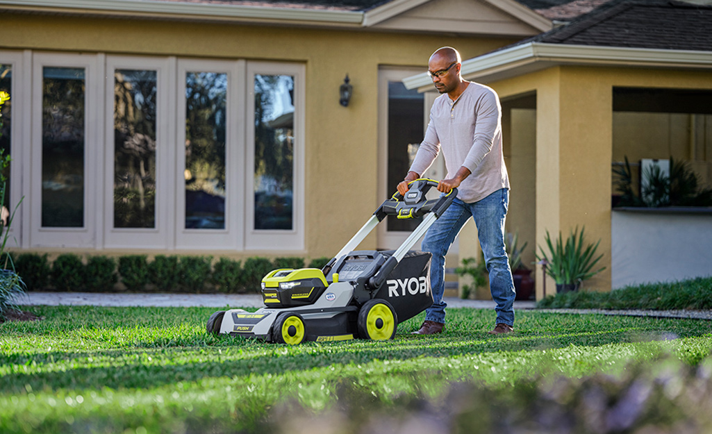 Person mowing lawn 