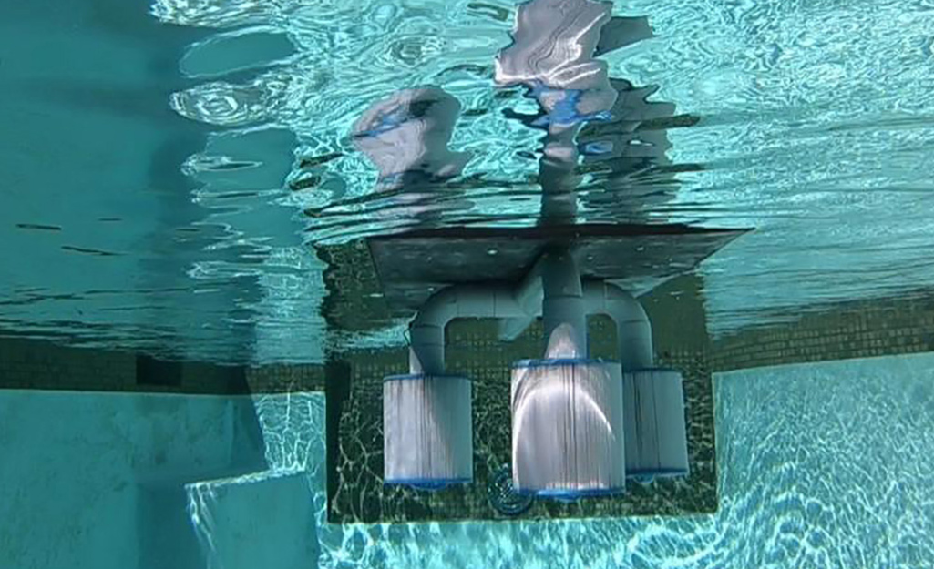 A pool pump filters water in a swimming pool.