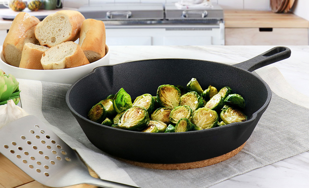 Brussels sprouts in a cast iron frying pan. 