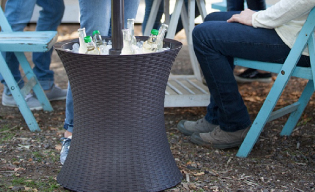 A beverage cooler filled with ice and bottles.