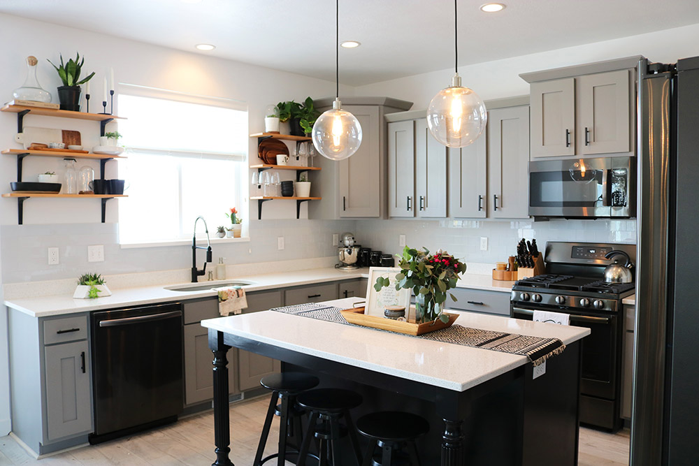 An updated kitchen with GE black stainless steel appliances.