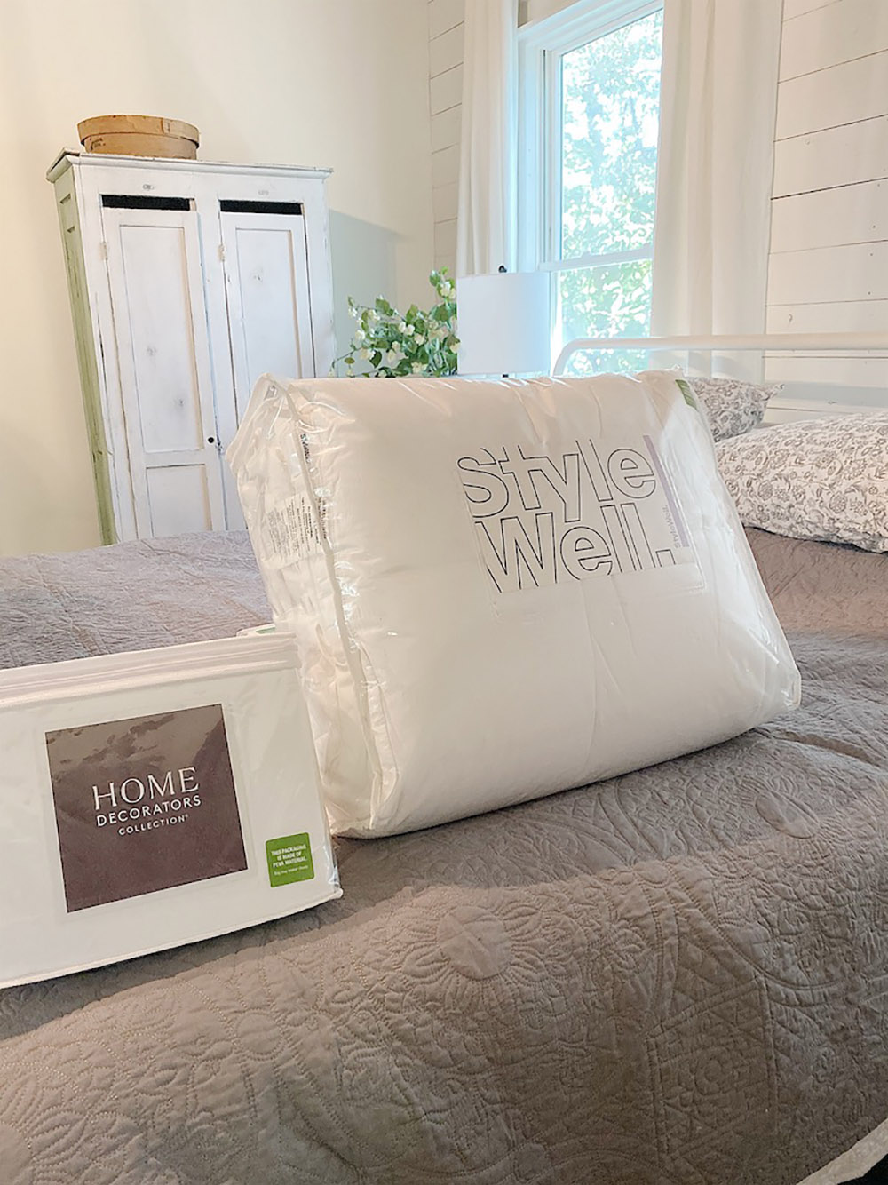 A Home Decorators Collection sheet set sitting on top of a bed.