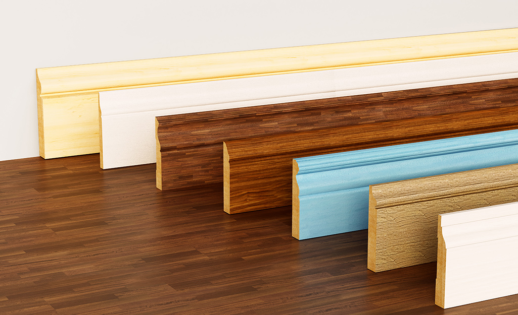 Different types of baseboard profiles on a wood floor.