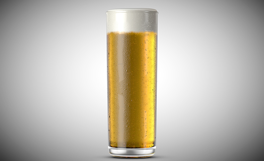 A stange glass filled with beer.