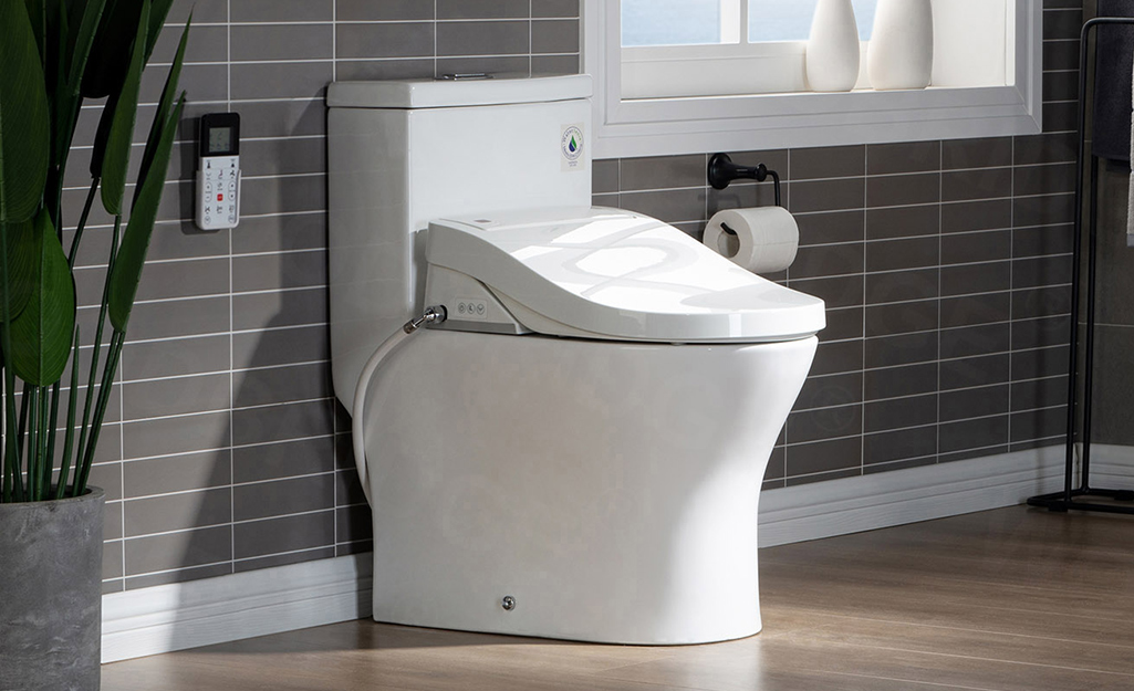 A white toilet with a bidet toilet seat.