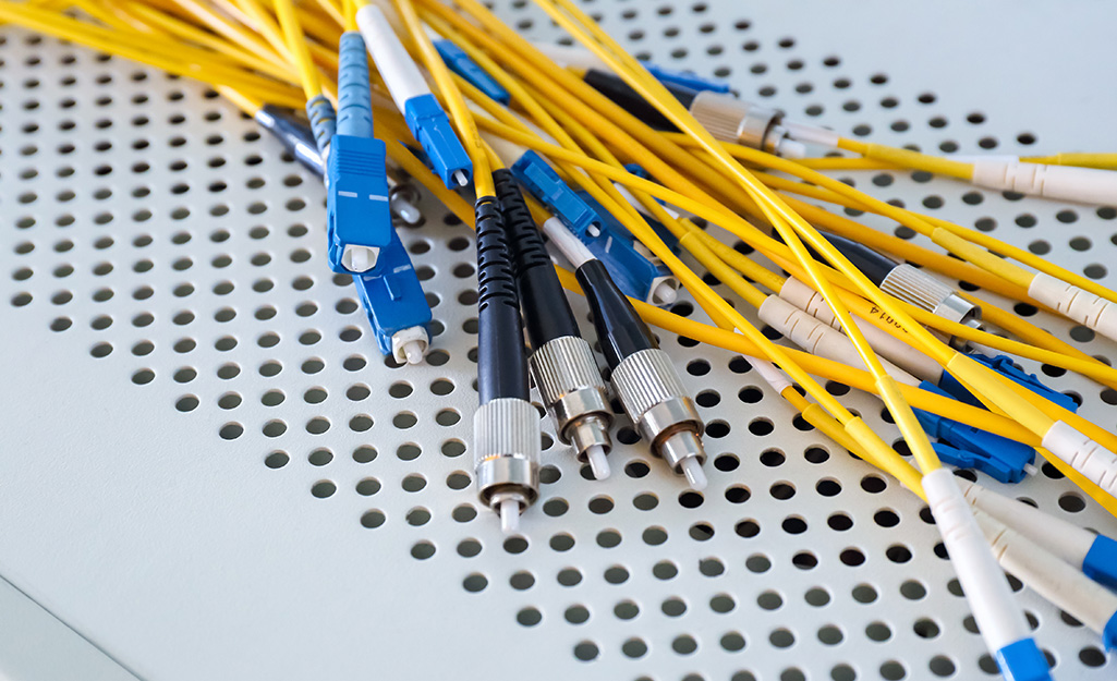 A group of fiber optic cables with yellow insulation wires.