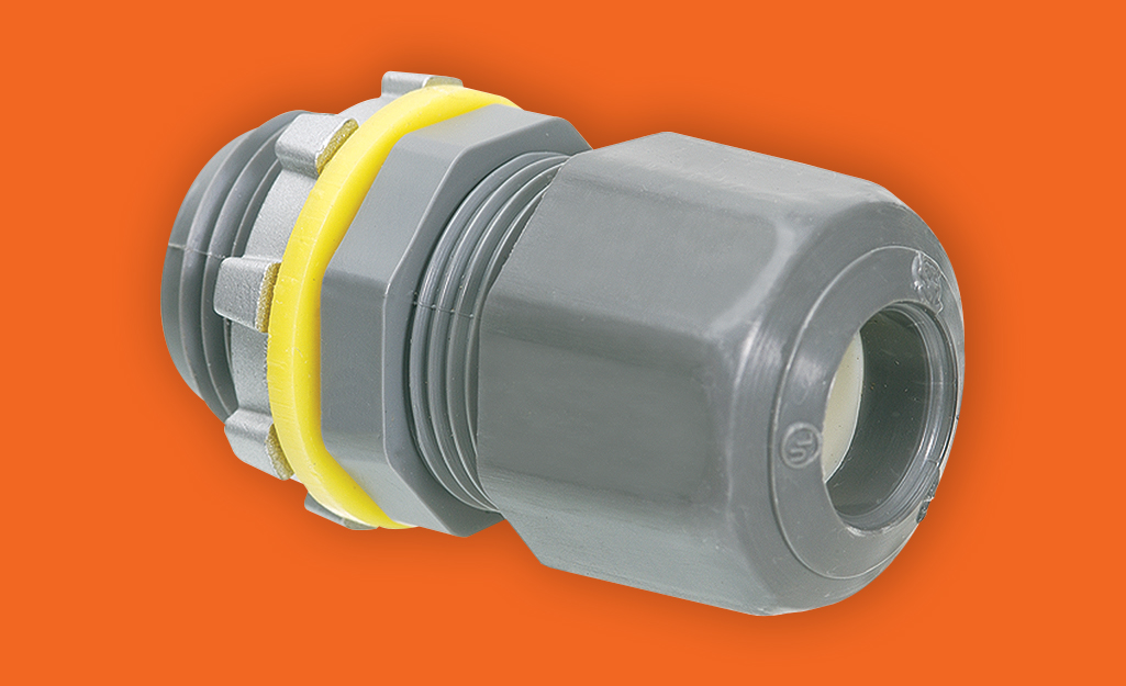 A conduit connector featuring a yellow band.