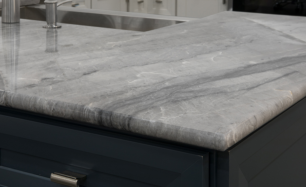 A gray granite countertop with bullnose edges.