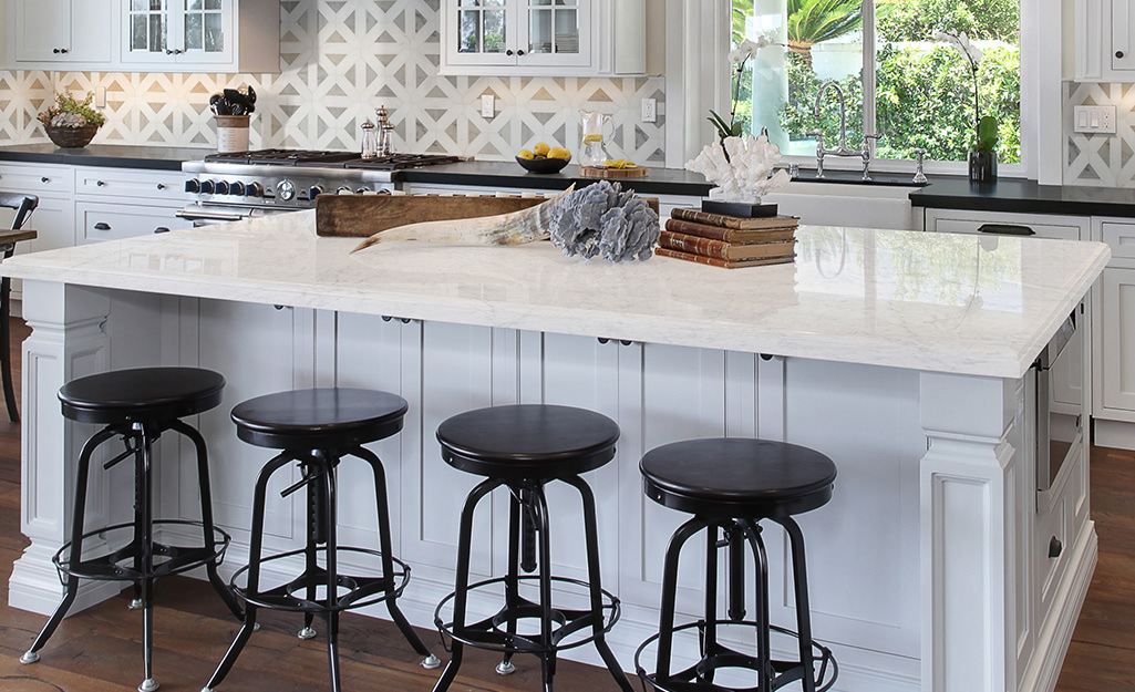A kitchen with a marble countertop.