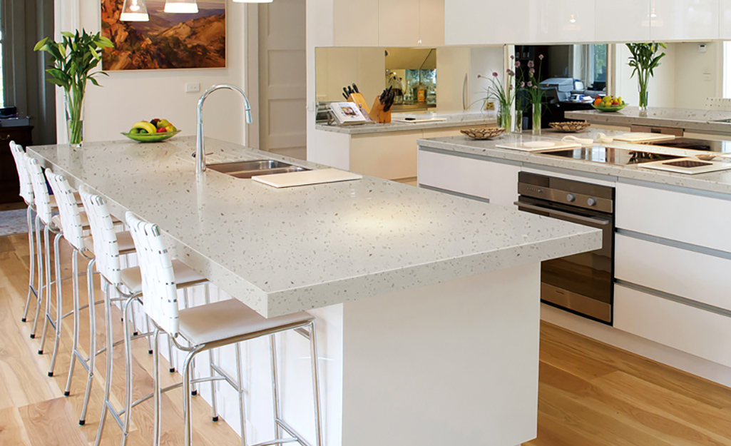 A kitchen with solid surface countertops.