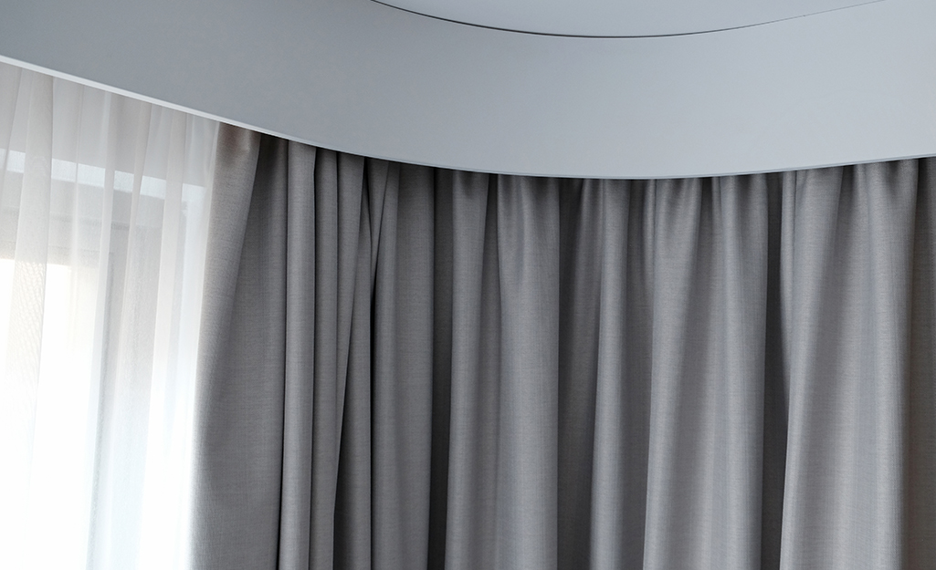 A concealed rod holding a circular curtain.