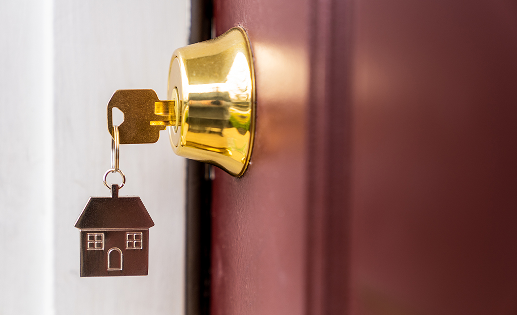 A key inserted into a door lock.