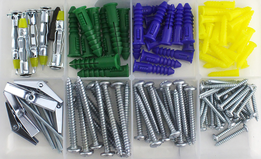 A plastic case contains multiple types of wall anchors.