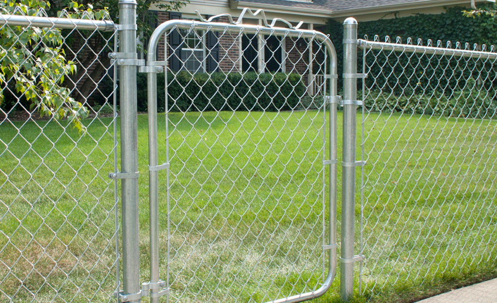 A chain link fence with a gate.