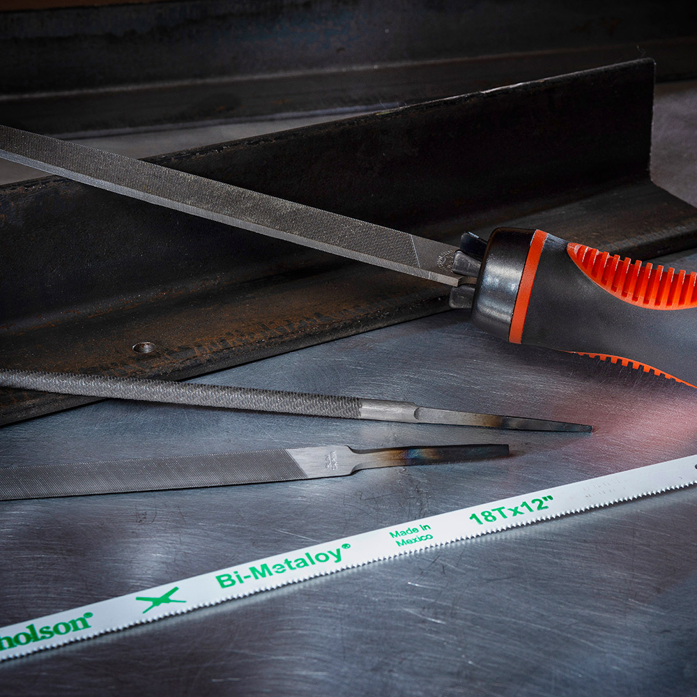 An assortment of file tools on a work table.