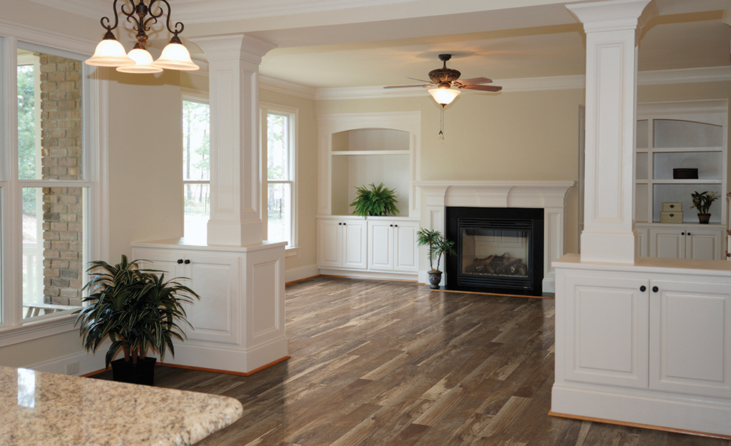 Laminate flooring in a living room and hallway area. 