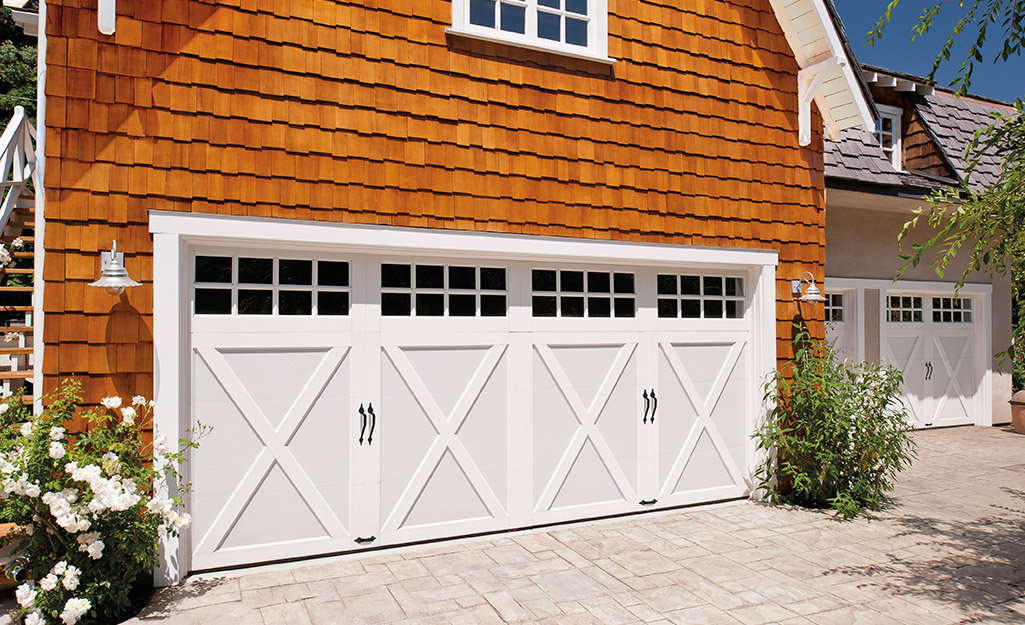 A detached garage with a double-sized garage door.