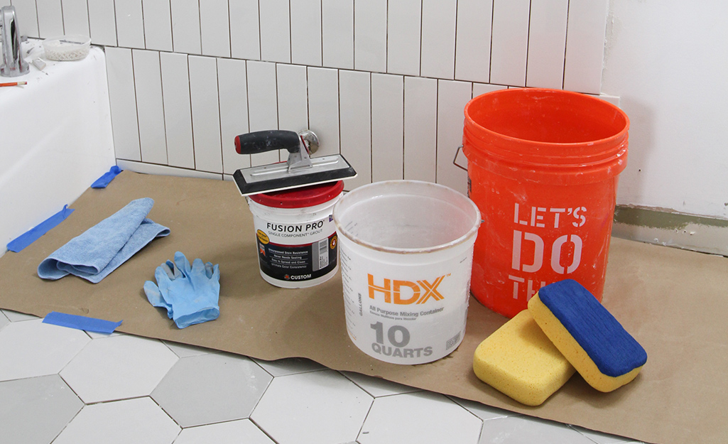 Buckets, gloves and other grout application materials. Buckets, gloves and other grout application materials.