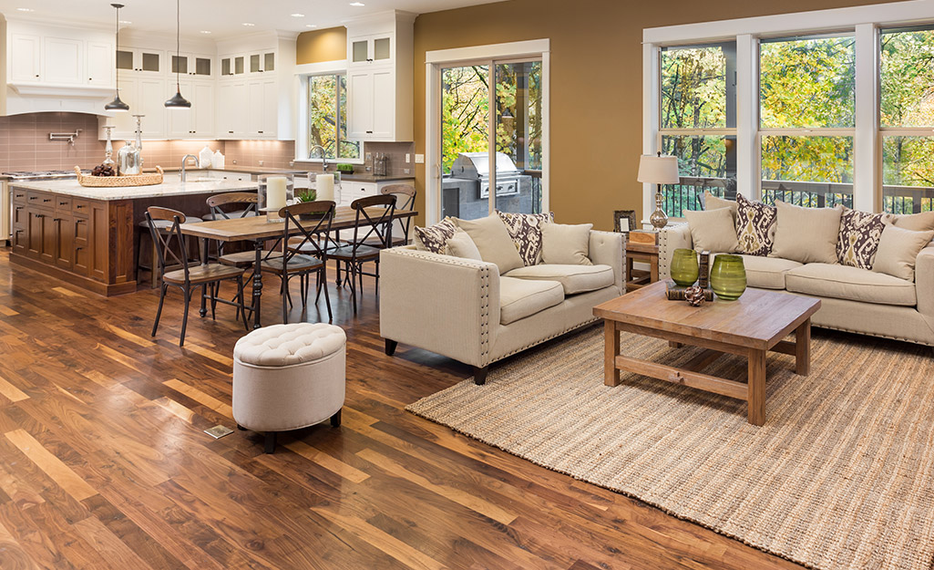 A living space with solid hardwood flooring installed.