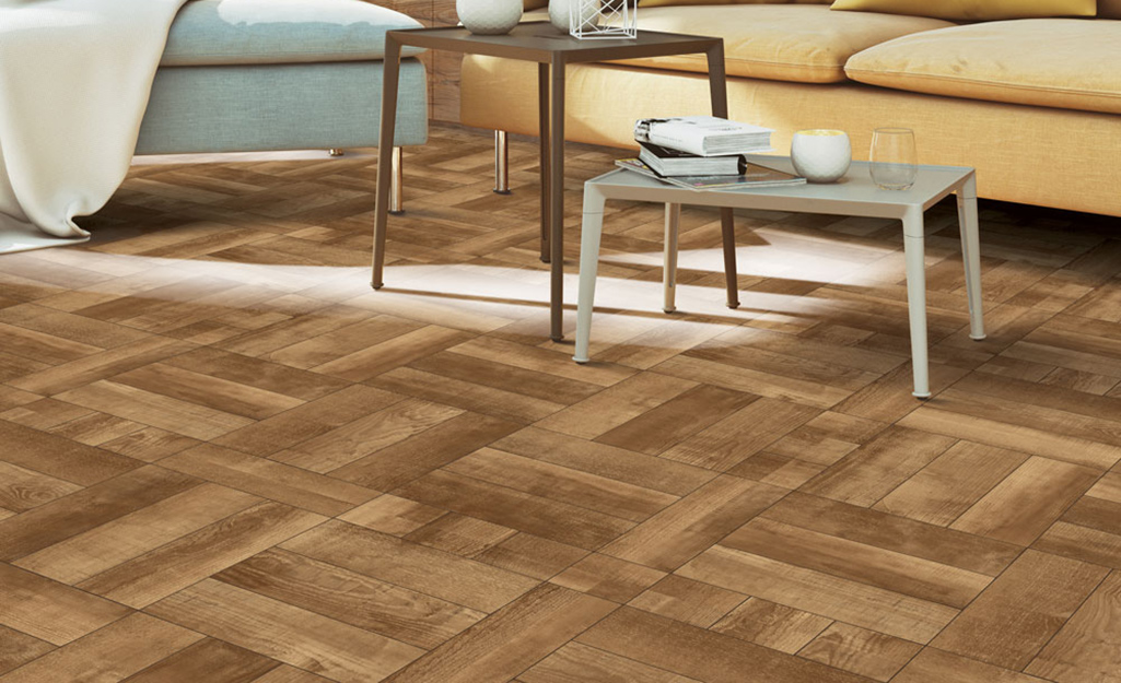 A room with parquet style hardwood flooring.