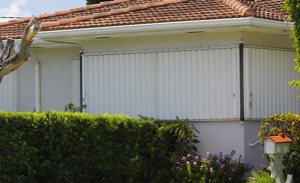 Hurricane shutters installed on a home's windows. 