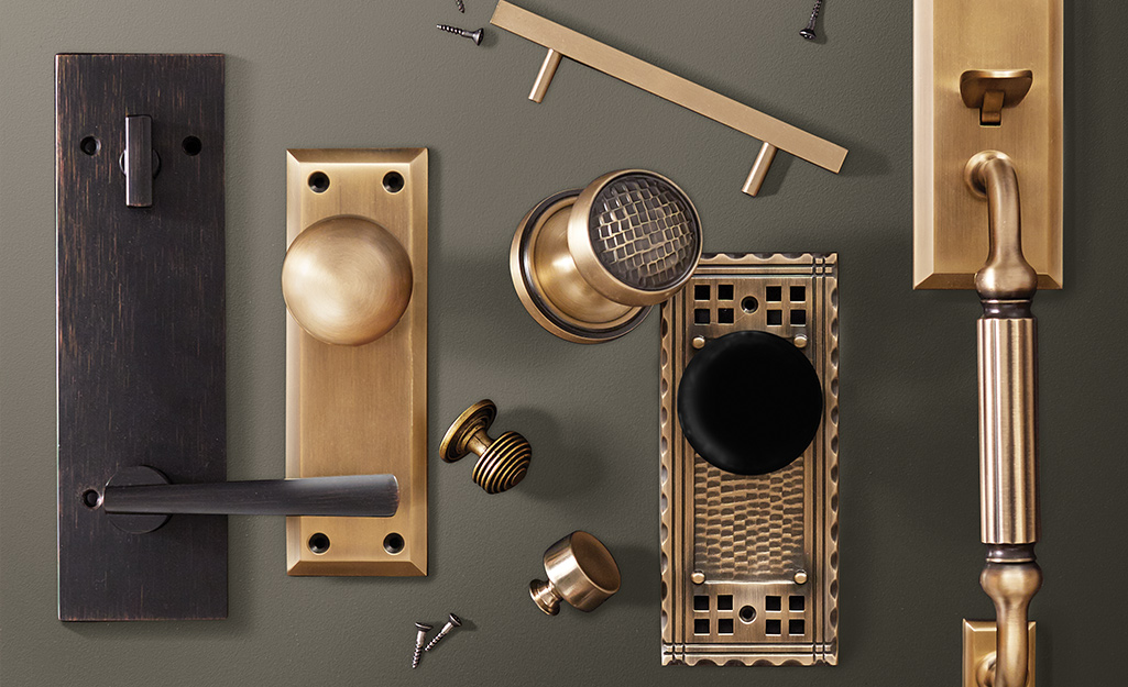 An assortment of door hardware lying on a table.