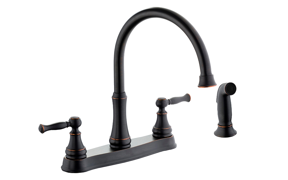 A standard two-hole deck plate faucet with side sprayer.