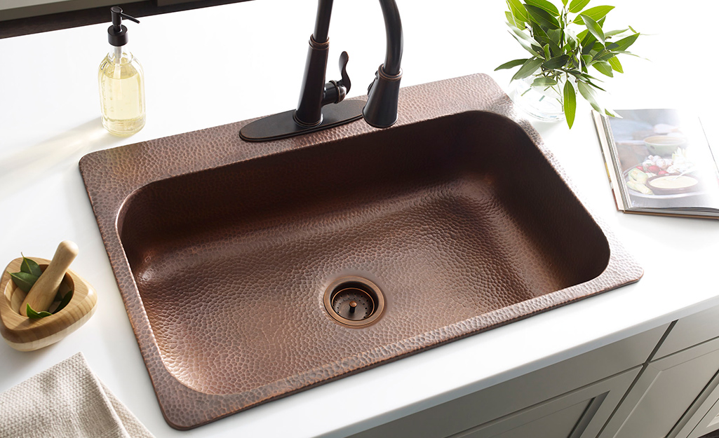 A copper single bowl sink.