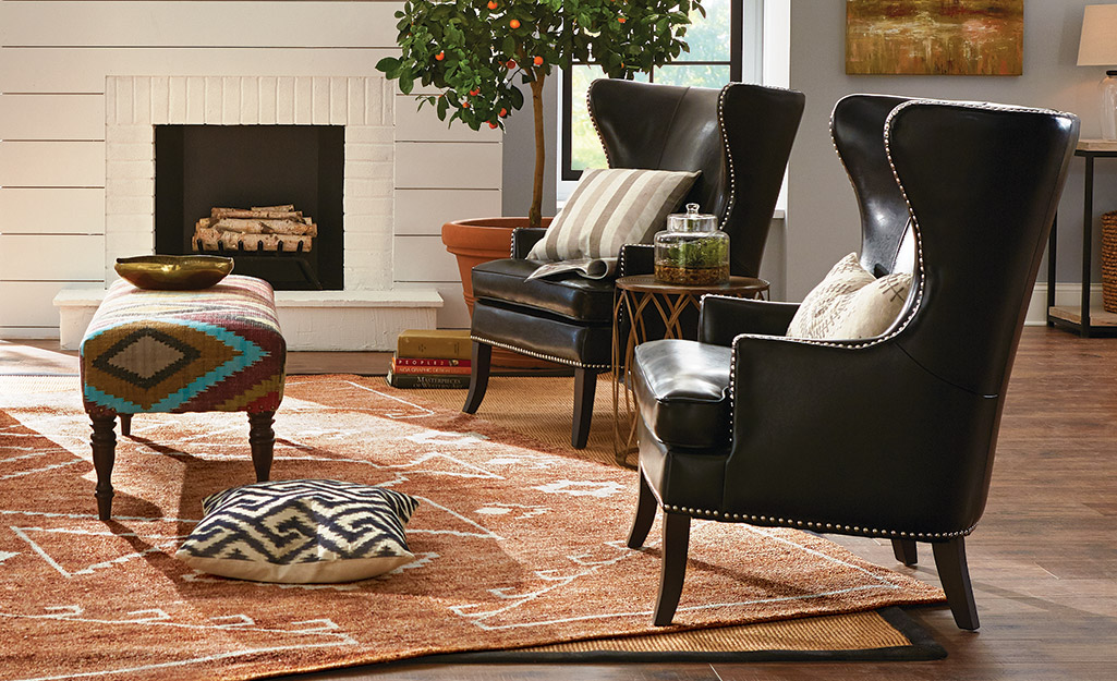 two leather accent chairs in a living room