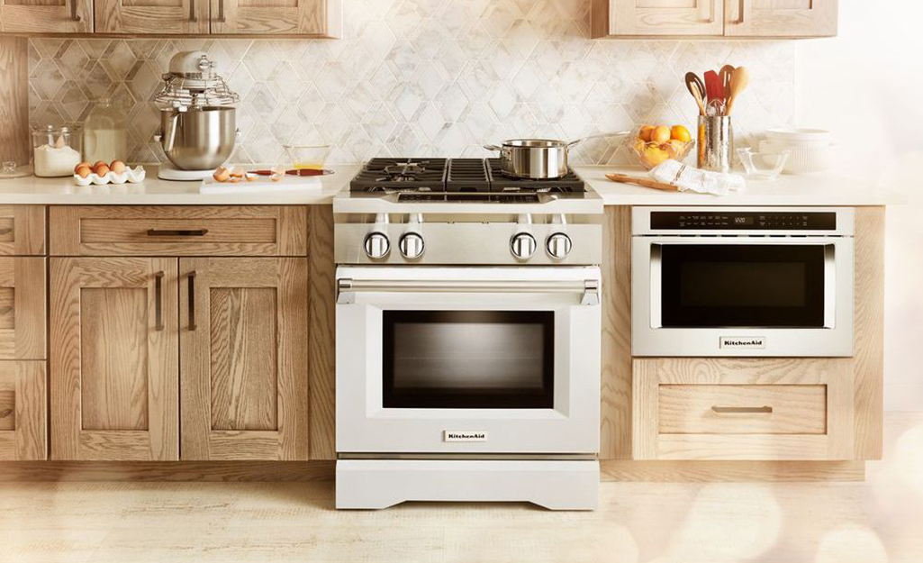 A drawer microwave in a kitchen.