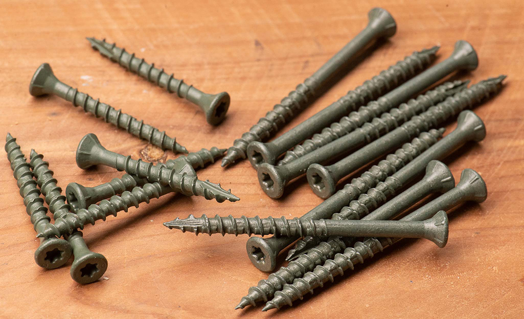 Deck screws stacked on top of one another.