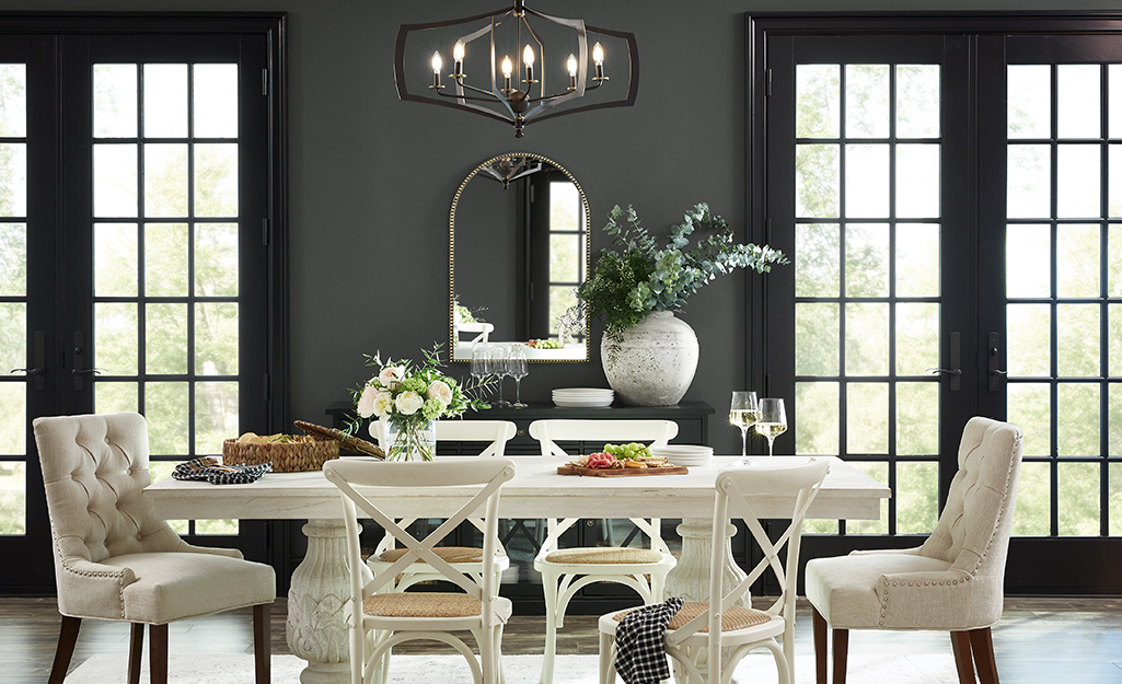 A dining room is painted in a gray paint