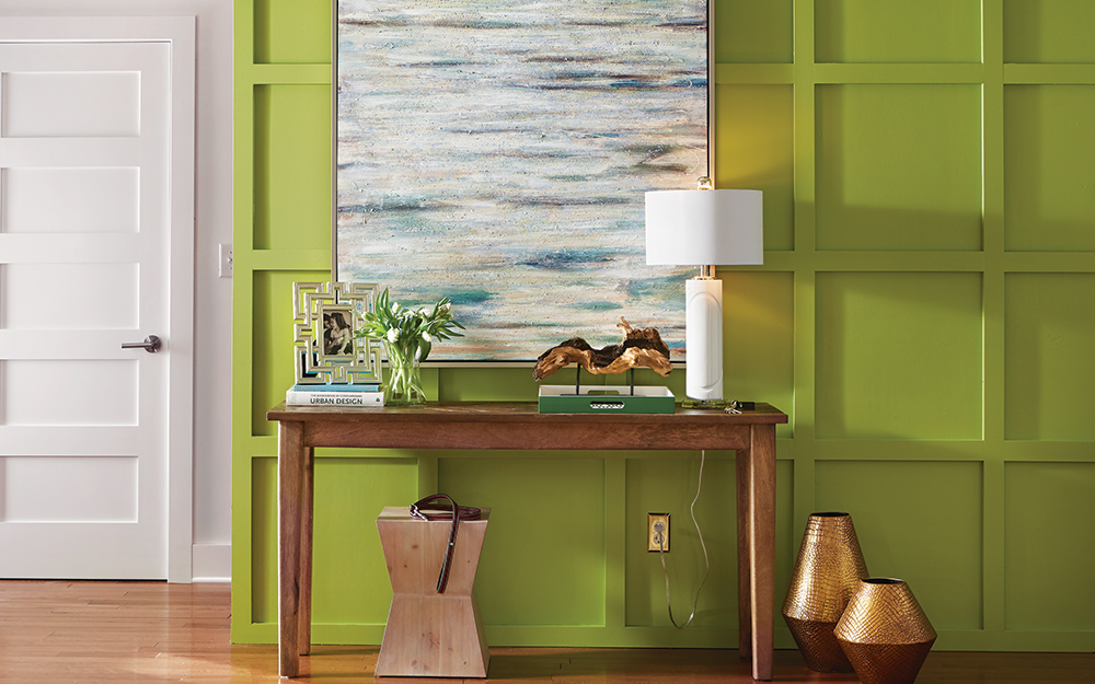 An entryway painted in a bold shade of green. 
