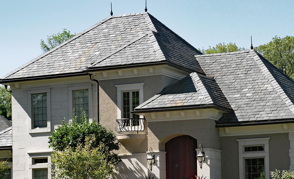 A house featuring a slate tile roof.